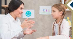 counselor works with elementary student