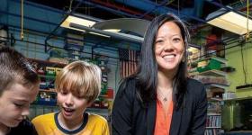 Stephanie Lin pictured with two students in a science lab. Photo used in Arlington Magazine courtesy of Skip Brown.
